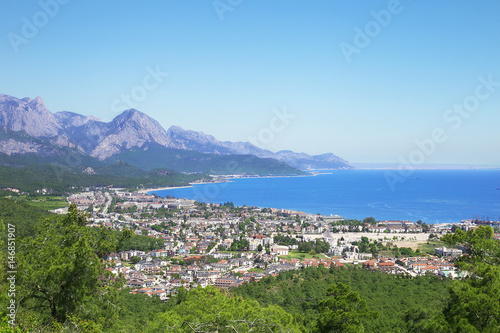 View of the town of Kemer from the top of the mountain. Blue sea  sky  mountains and city. Turkey