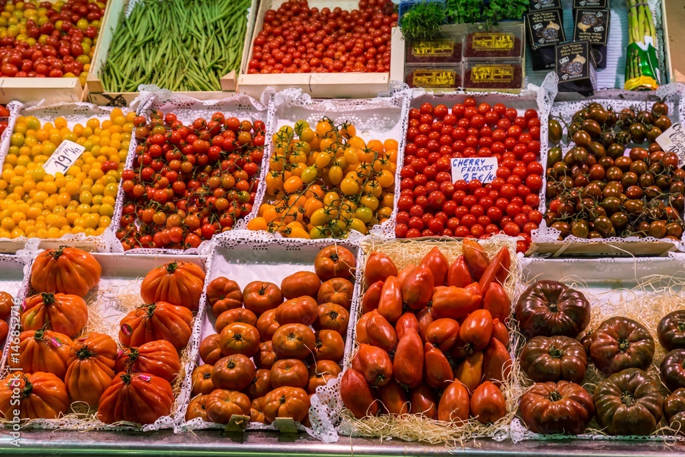 Famous La Boqueria market with vegetables and fruits in Barcelona, Spain