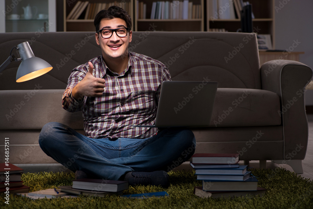 Student reading books preparing for exams Student reading books preparing for exams