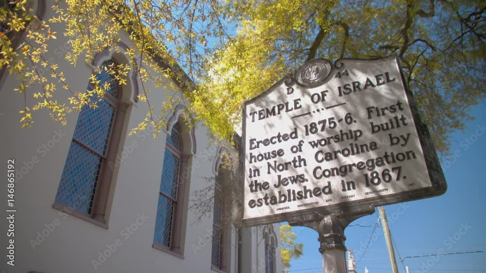 Wilmington NC Temple of Israel Exterior Signage Close-up with Landmark History Information under a Tree on a Sunny Day in North Carolina