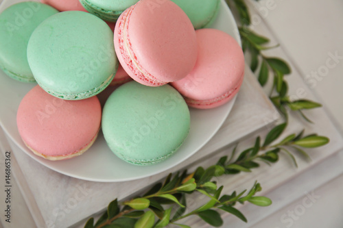 Plate with macarons on wooden stand