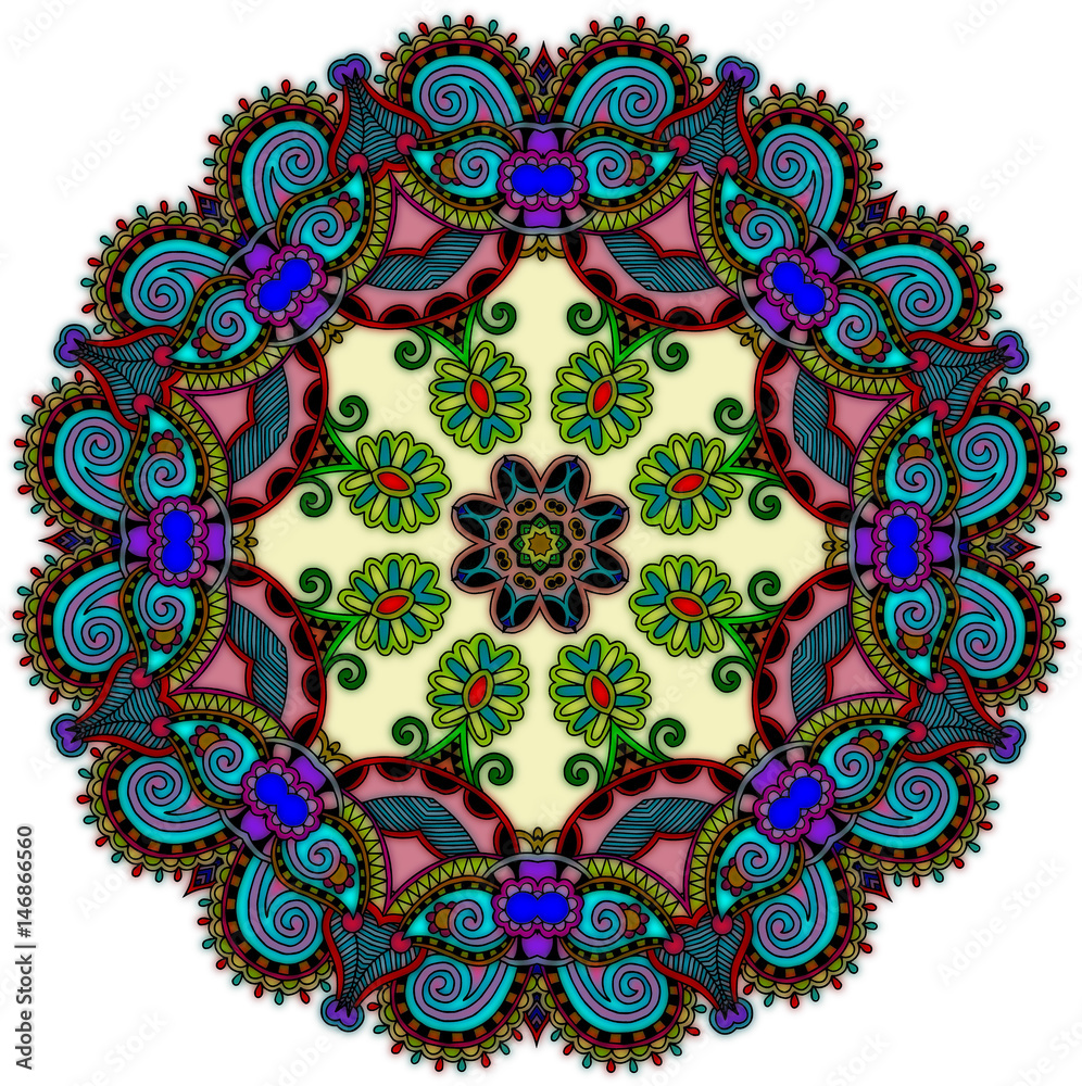 Circular very busy design with darker colors near the border with lighter center.  Many multi-colored design.