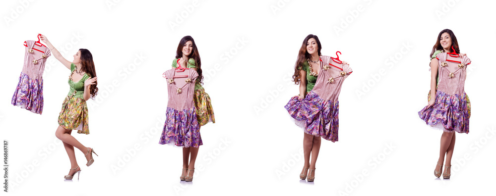 Woman trying to choose dress on white