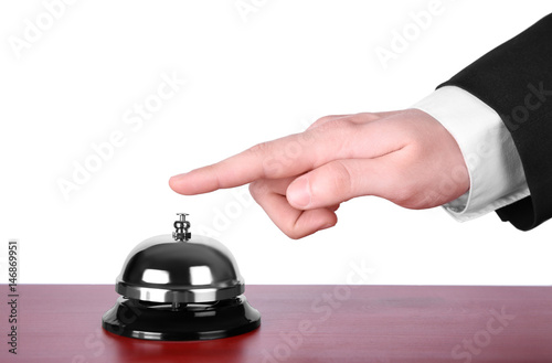 Man ringing service bell isolated on white