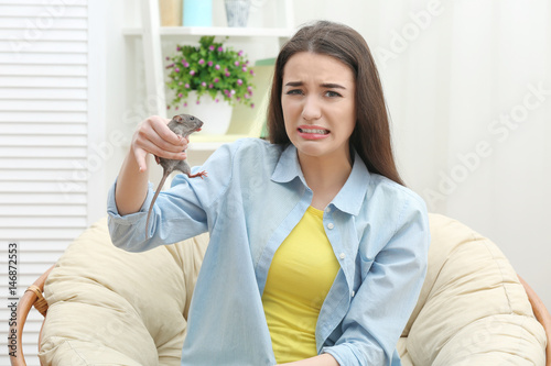 Young woman with funny rat ...