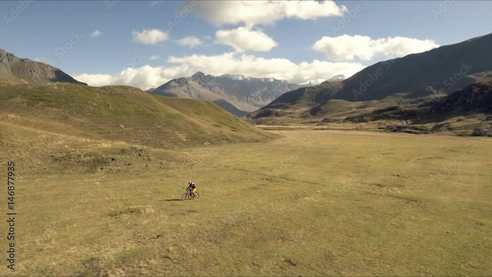 custom made wallpaper toronto digitalAerial shot of mountain biker riding the trail on alpine pass in autumn season