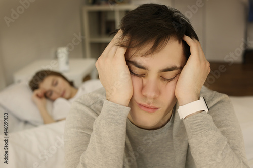 Tired young man with sleep ...