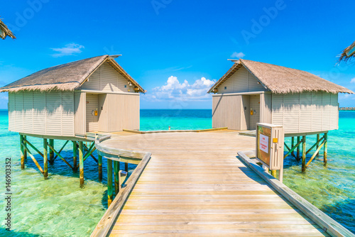 Beautiful water villas in tropical Maldives island .