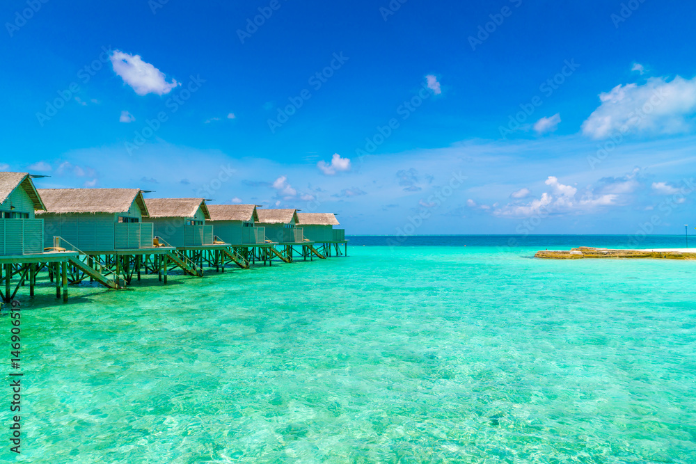 Beautiful water villas in tropical Maldives island  .