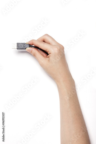 woman hand hold a power plug isolated white