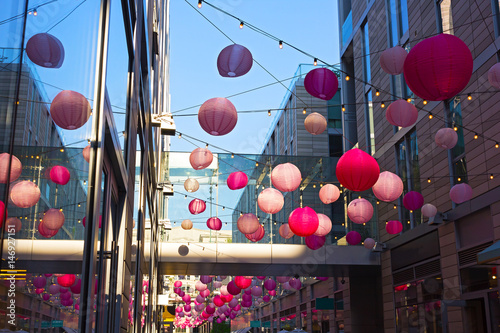 DC City Center festive atmosphere during cherry blossom annual events in Washington DC, USA. City Center features boutiques and restaurants along pedestrian alley.