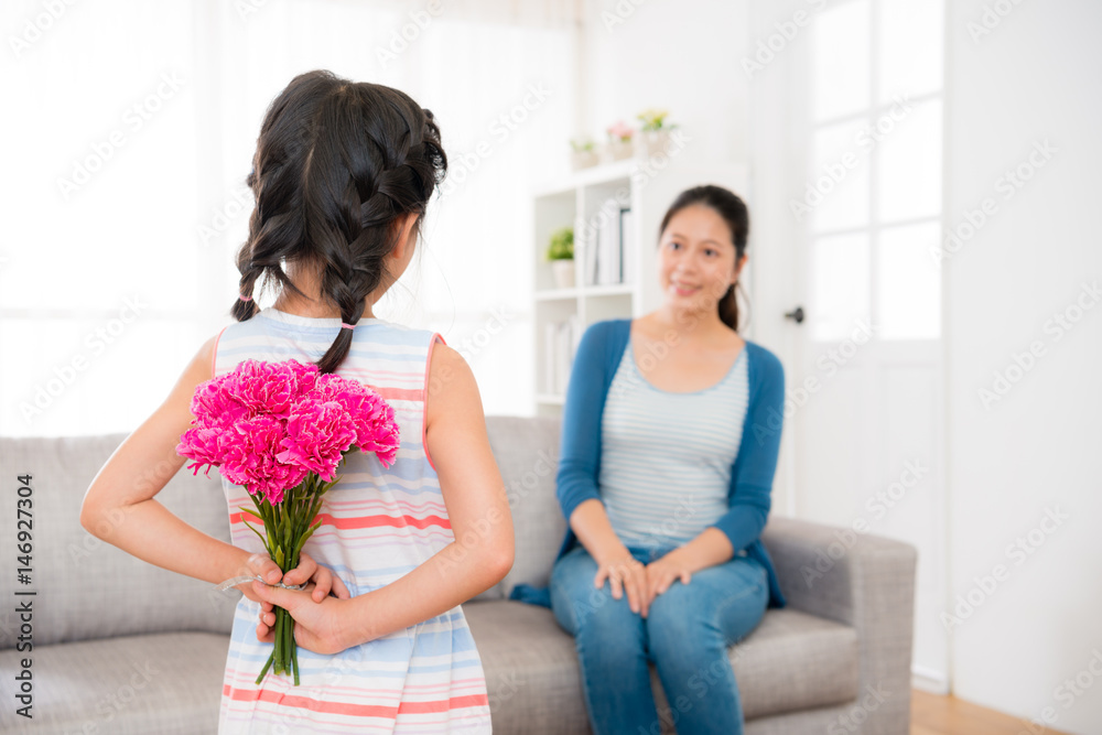 asian little girl holding pink carnations bouquets asian little girl holding pink carnations bouquets