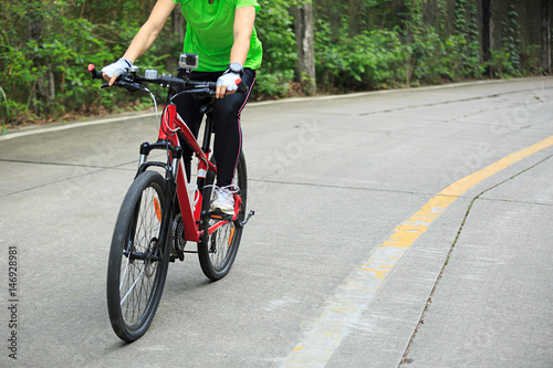 cyclist cycling mountain bike on forest trail