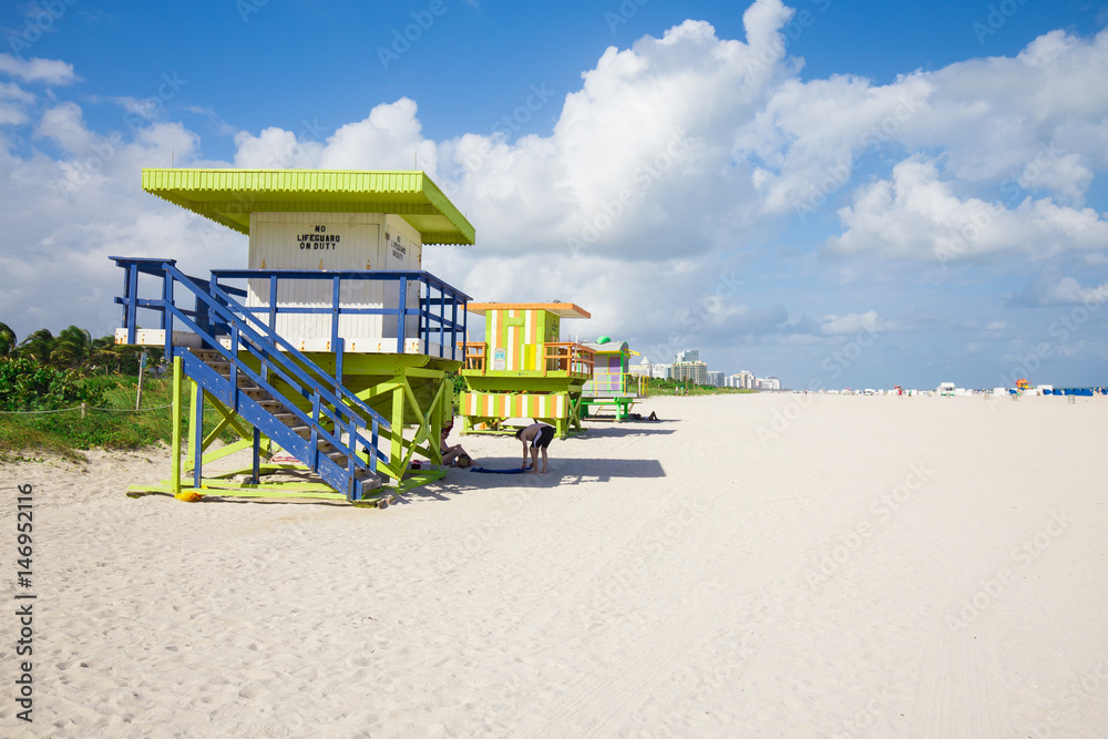 USA. FLORIDA. MIAMI BEACH, APRIL,2017: Miami Beach in South Beach with new lifeguard tower and coastline with colorful cloud and blue sky. Florida. USA. FLORIDA. MIAMI BEACH, APRIL,2017: Miami Beach in South Beach with new lifeguard tower and coastline with colorful cloud and blue sky. Florida.