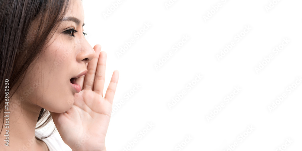 Young woman screaming to her right on isolated white background - copyspace Young woman screaming to her right on isolated white background - copyspace