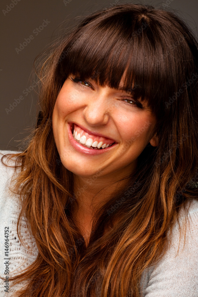 Beautiful young happy woman laughing and smiling. Beautiful young happy woman laughing and smiling.