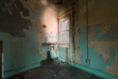 empty hotel room in dilapidated hotel © Chris