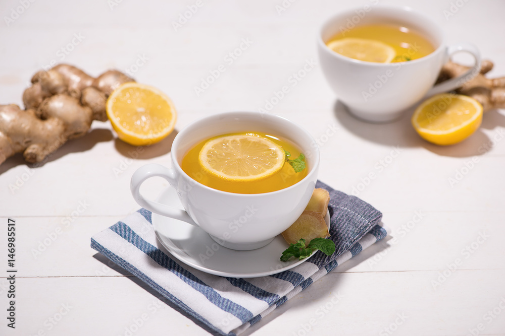 Healthy ginger tea ingredients on a wooden table Healthy ginger tea ingredients on a wooden table