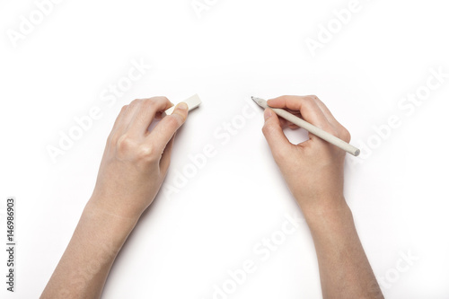 woman hand hold a pencil, write something isolated white.