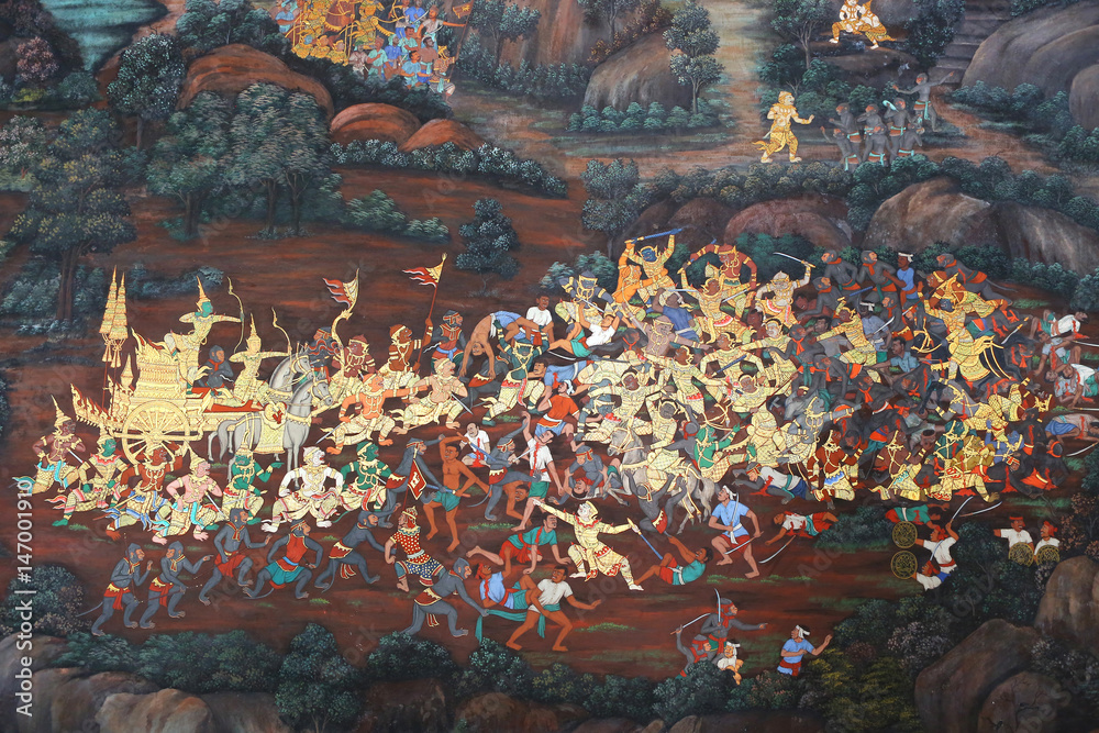 Fototapeta premium Traditional Thai painting art about Ramayana story on display at the temple wall Wat Prakaew in Bangkok, Thailand.