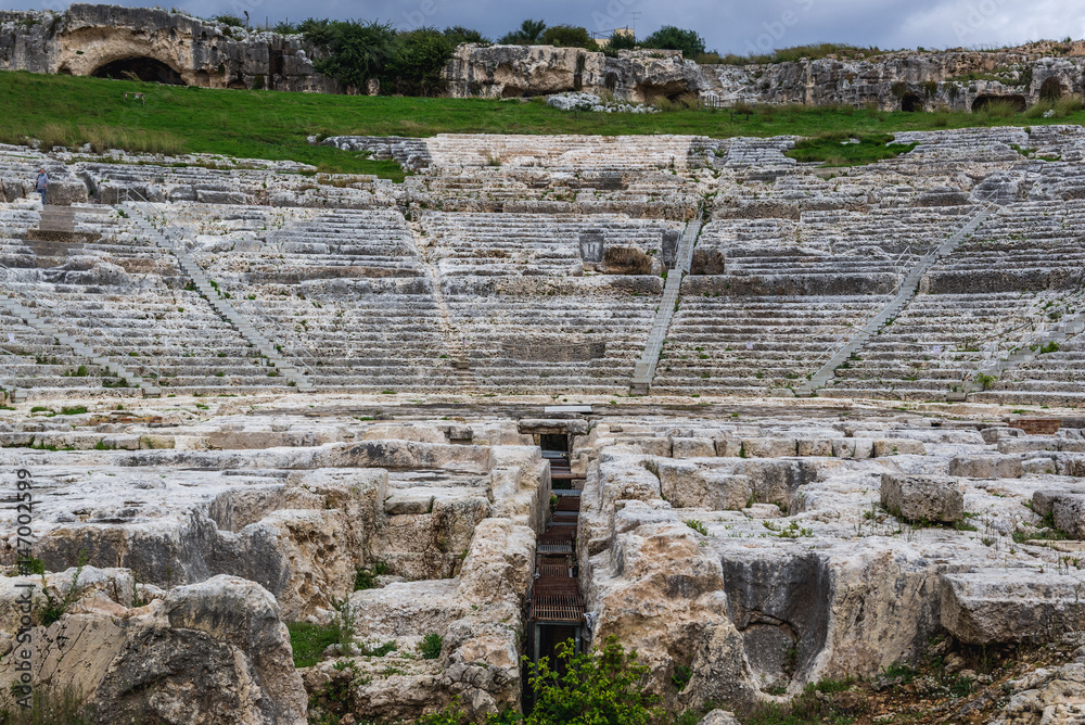 Cavea (ancient auditorium) of Greek theater in Neapolis Archaeological Park in Syracuse, Sicily Island of Italy