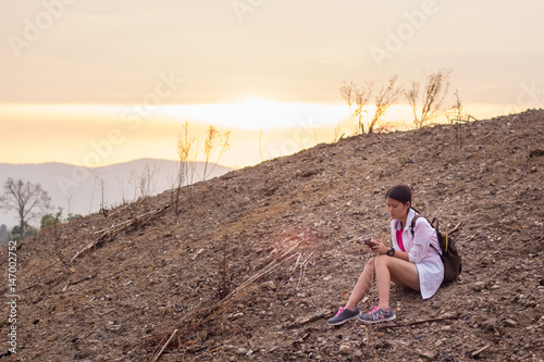 Woman sitting on the hill,Sitting on the hill