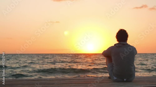 Close up of a Man Watching a Dawn at the End of the Day