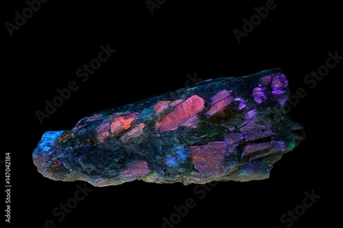 Lithium mineral spodumene showing fluorescence in ultraviolet light