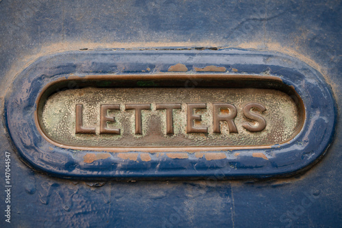 Vintage letter box with letters engravement on the clap.