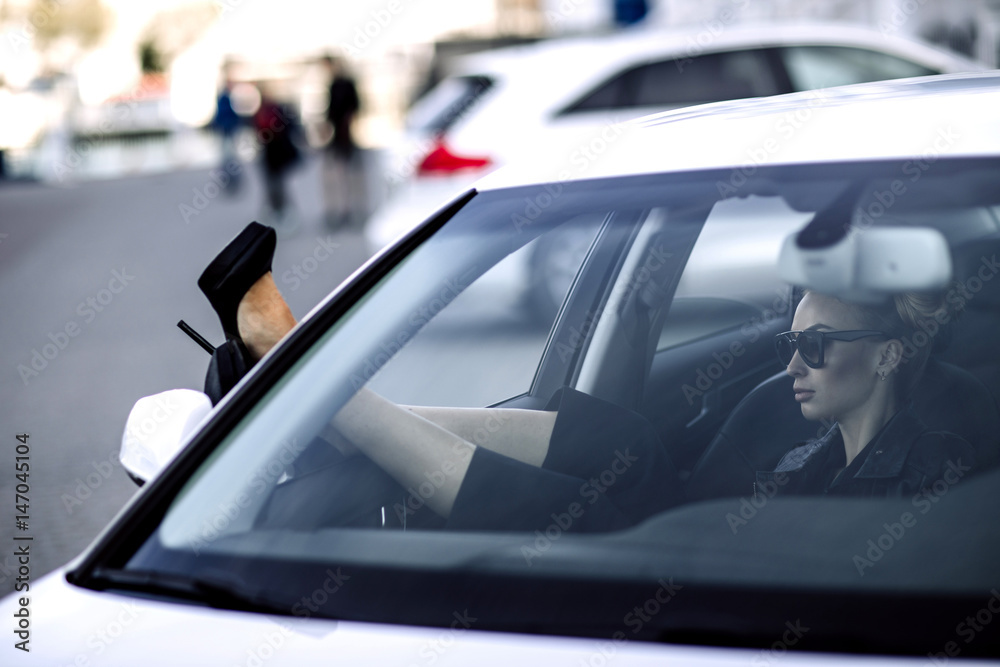 fashion outdoor photo of sexy beautiful woman with dark hair in black leather jacket and sunglasses posing in luxurious auto fashion outdoor photo of sexy beautiful woman with dark hair in black leather jacket and sunglasses posing in luxurious auto