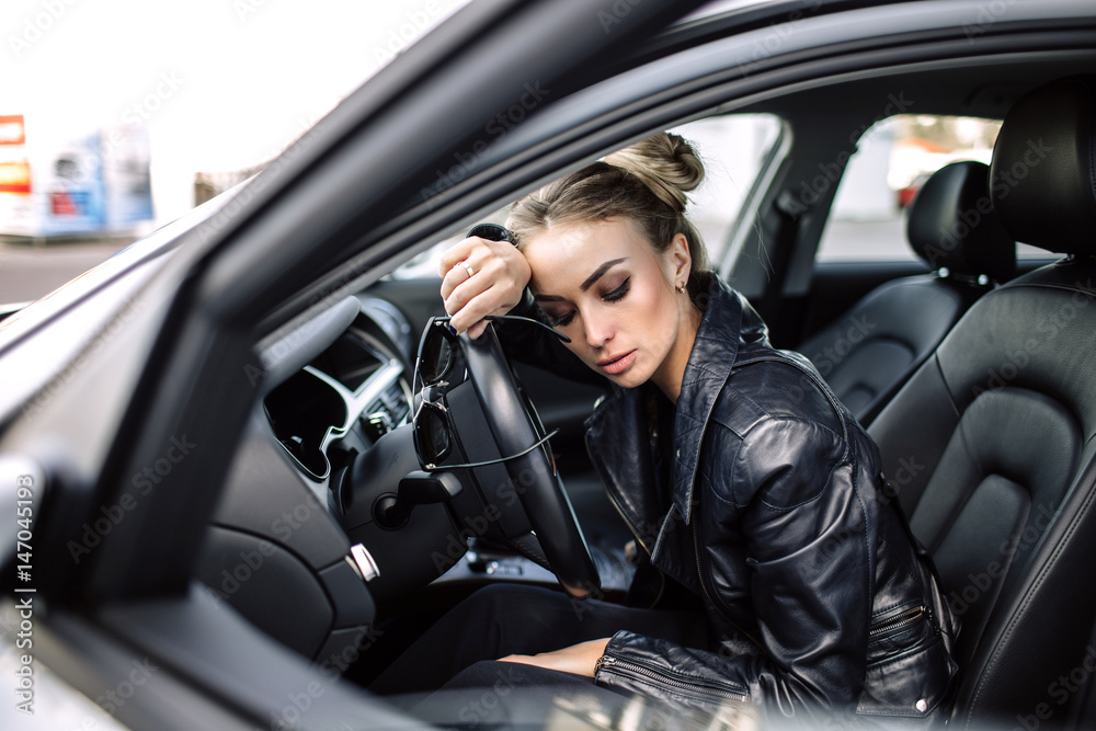 fashion outdoor photo of sexy beautiful woman with dark hair in black leather jacket and sunglasses posing in luxurious auto fashion outdoor photo of sexy beautiful woman with dark hair in black leather jacket and sunglasses posing in luxurious auto