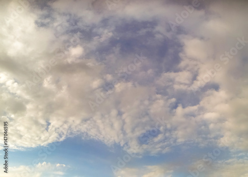 white fluffy clouds in the blue sky