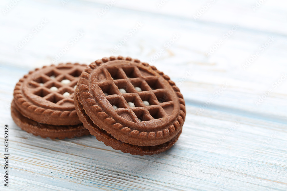 Chocolate cookies with cream on white wooden table Chocolate cookies with cream on white wooden table