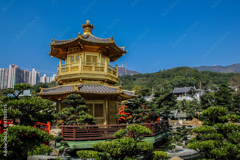 Hong Kong, China, January 30, 2013: Tourists visiting traditional Chinese park in the center of Hong Kong Hong Kong, China, January 30, 2013: Tourists visiting traditional Chinese park in the center of Hong Kong