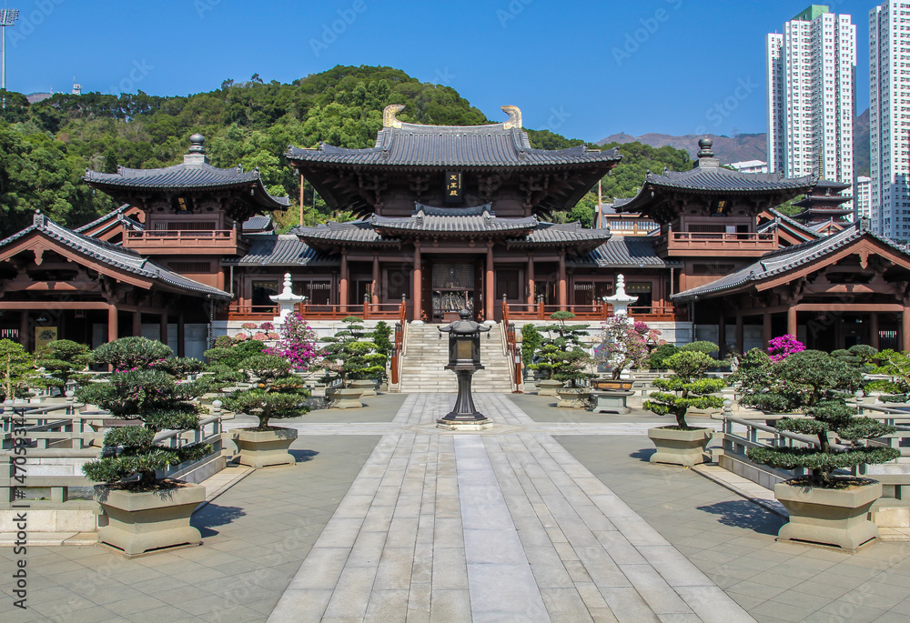 Hong Kong, China, January 30, 2013: Tourists visiting traditional Chinese park in the center of Hong Kong Hong Kong, China, January 30, 2013: Tourists visiting traditional Chinese park in the center of Hong Kong