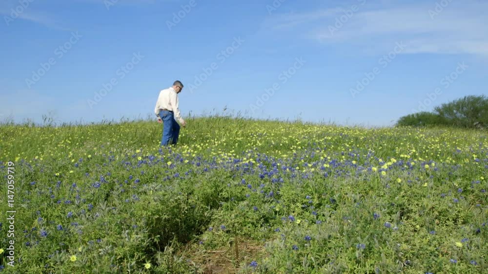 A photographer scoping out the best place to take photographs in the Southeast Texas Bluebonnets. A photographer scoping out the best place to take photographs in the Southeast Texas Bluebonnets.