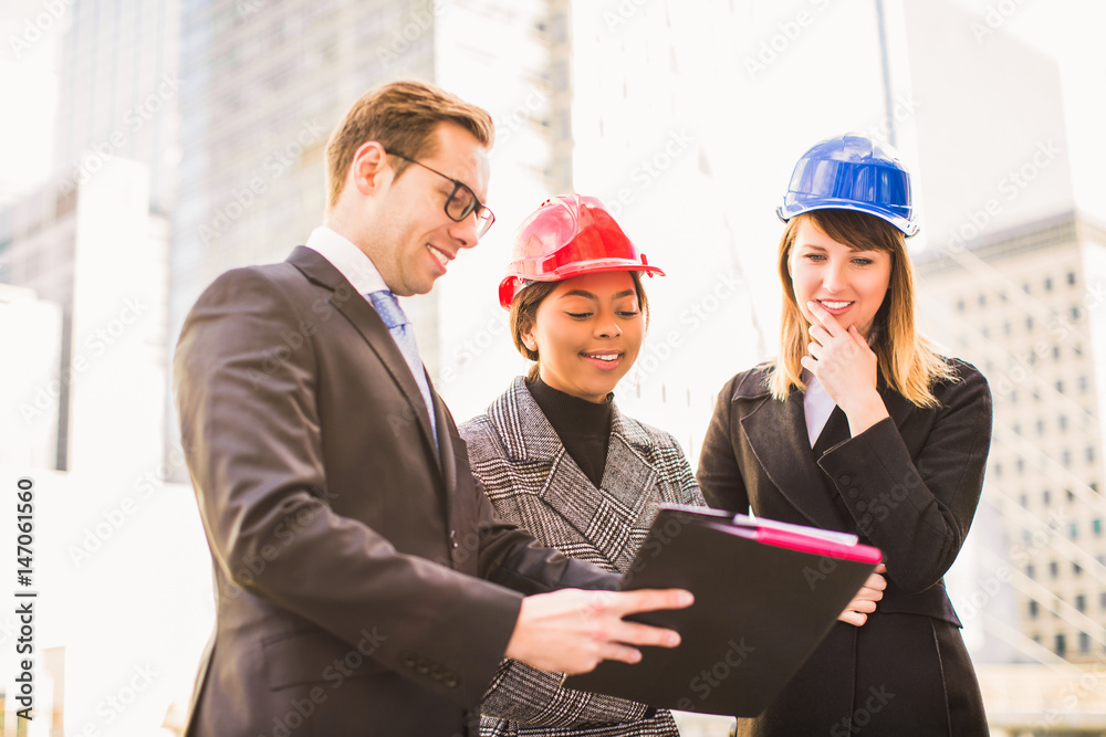 businessman concludes a contract for a new project with representatives of the construction company, outdoors businessman concludes a contract for a new project with representatives of the construction company, outdoors