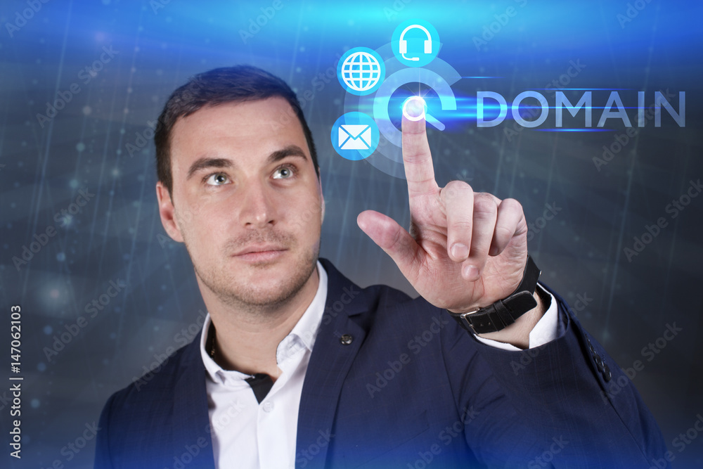 Obraz premium Business, Technology, Internet and network concept. Young businessman working on a virtual screen of the future and sees the inscription: Domain