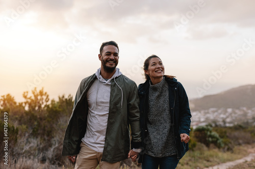 Happy hikers walking in the countryside