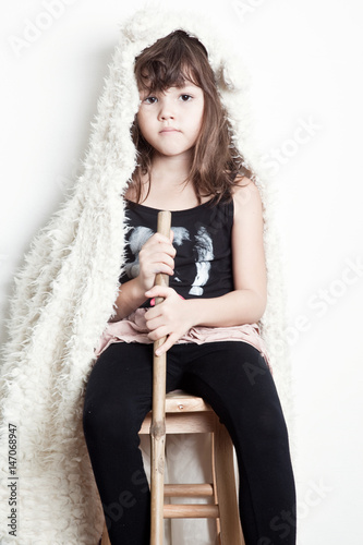 Llittle actress sitting on chair  photo