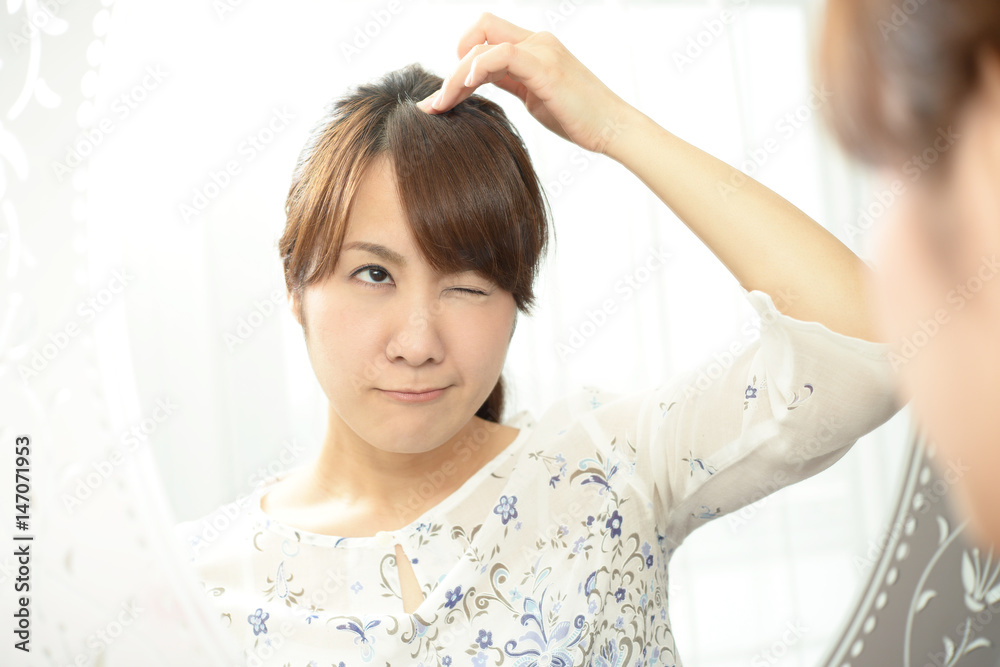 ヘアケアに不満な女性
