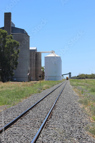 Railway line with silos and train