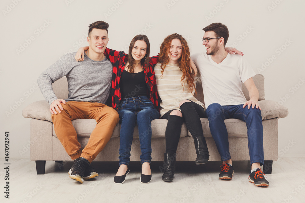 Party with friends, young people sitting on couch Party with friends, young people sitting on couch