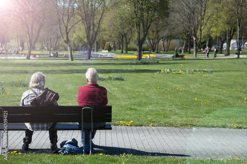 Mature couple enjoying a sunny day together at the bank