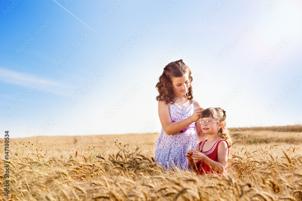 Little girls playing in the golden wheat field.Copy space Stock Photo ...