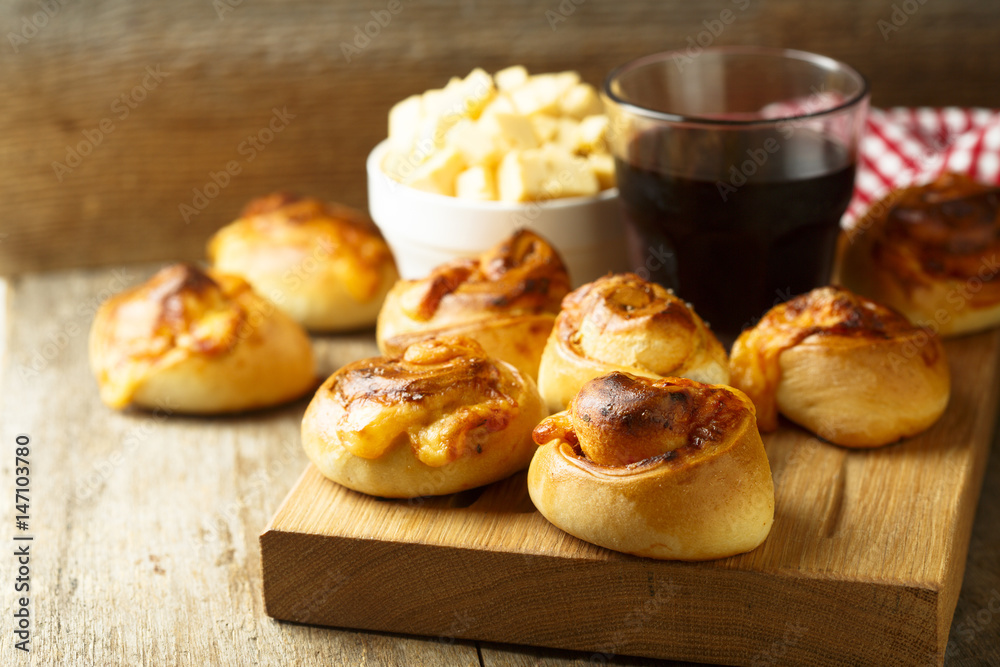 Homemade cheese buns with tomato sauce and herbs