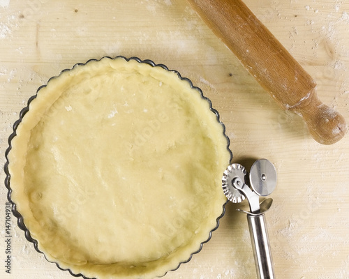 Shortcrust pastry on wooden background - top view