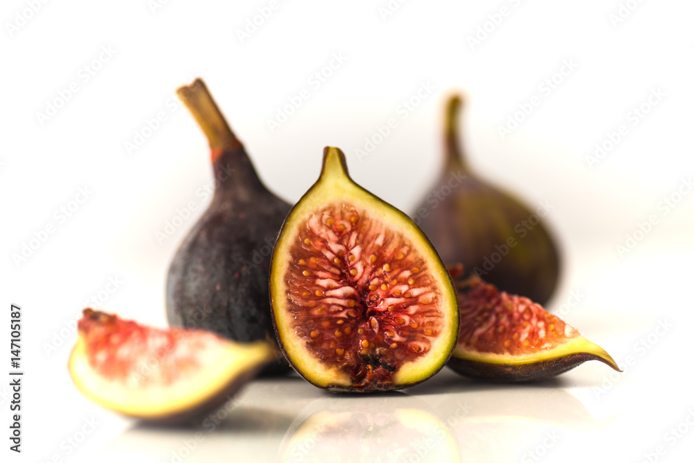 Figs on a reflective white surface Figs on a reflective white surface