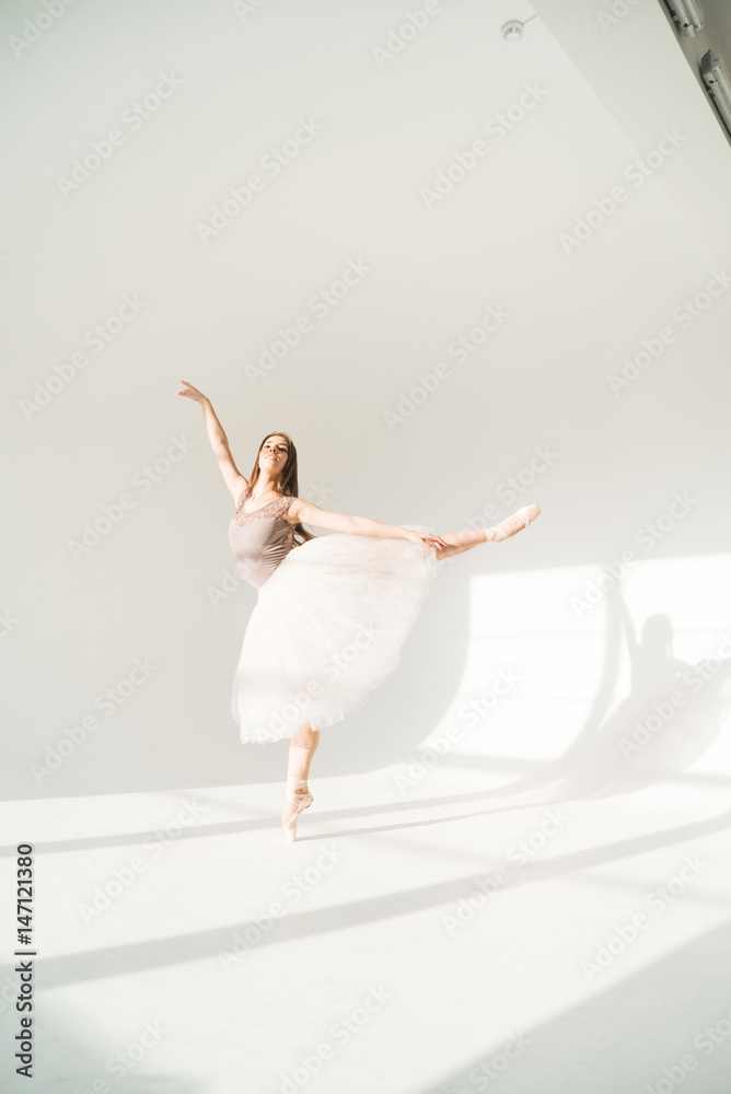 woman with blowed dress by wind. sunny dance studio