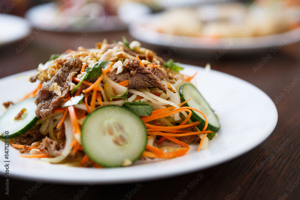 Vietnamese restaurant menu.Tasty vegetable salad with beef meat Vietnamese restaurant menu.Tasty vegetable salad with beef meat